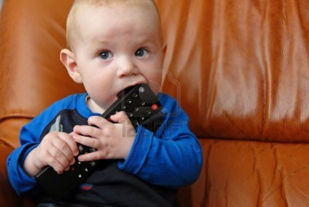 4926648-adorable-baby-boy-chewing-a-tv-remote